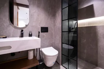 a bathroom with a white toilet and a mirror at Appartement luxueux plein centre Casablanca - 2 Personnes in Casablanca