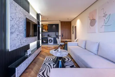 a living room with a couch and a table at Appartement luxueux plein centre Casablanca - 2 Personnes in Casablanca