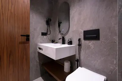 a bathroom with a white sink and a mirror at Appartement luxueux plein centre Casablanca - 2 Personnes in Casablanca