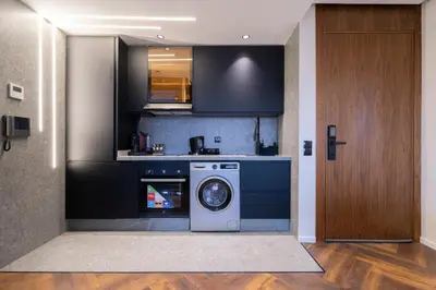 a kitchen with a washing machine in a room at Appartement luxueux plein centre Casablanca - 2 Personnes in Casablanca