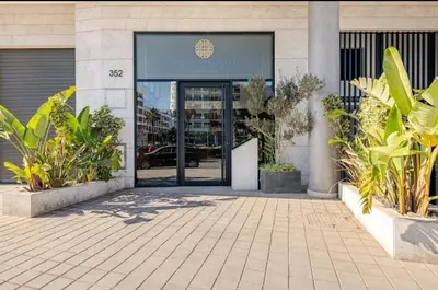 an entrance to a building with a revolving door at Carpediem in Casablanca