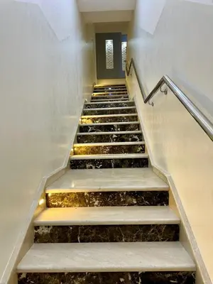 an empty stair case with steps in a building at Appartement haut standing, 2 chambres - Mohammedia in Mohammedia
