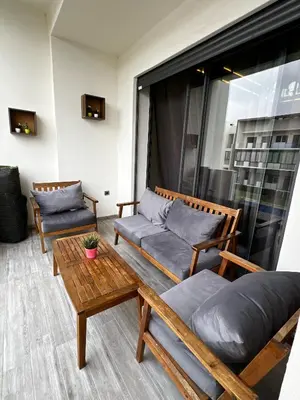 a living room with a couch and a table at Évasion de luxe Tamaris in Tamaris