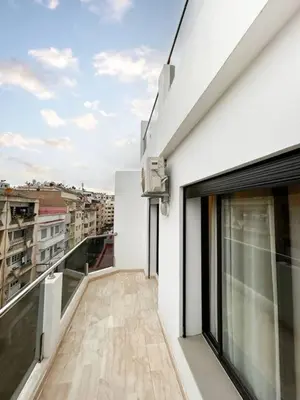 a balcony of a building with a view of a city at Appart familial cœur Casa in Casablanca