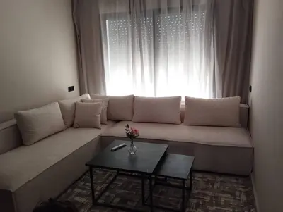 a couch in a living room with a window at Appart familial cœur Casa in Casablanca