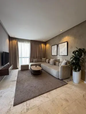 a living room with a couch and a tv at Luxury Studio Oasis in Casablanca