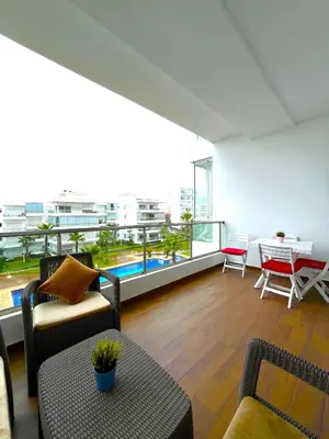 a living room with a view of a building at Seaside appartment with private pool in Tamaris