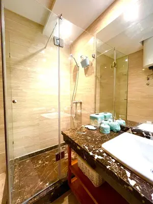 a bathroom with a sink and a shower at Seaside appartment with private pool in Tamaris