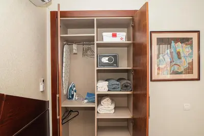 a closet with an open door with a camera on it at Domaine d'Anfa - Luxe & Mer in Casablanca