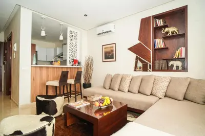 a living room with a couch and a table at Domaine d'Anfa - Luxe & Mer in Casablanca