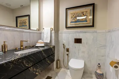a bathroom with a sink and a toilet and a mirror at شقة فاخرة - Luxury apartment in Casablanca