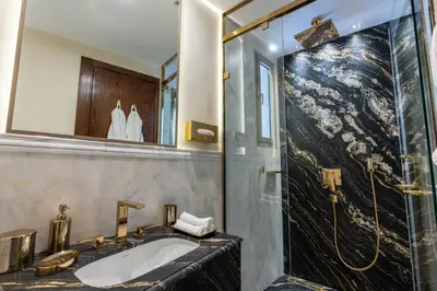 a bathroom with a sink and a shower at شقة فاخرة - Luxury apartment in Casablanca