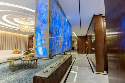 a hotel lobby with a large painting on the wall at شقة فاخرة - Luxury apartment in Casablanca