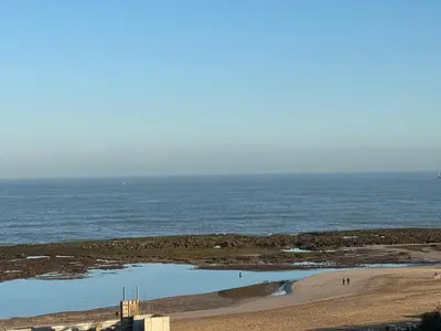 a view of a beach with a body of water at Plage manesmann in Mohammedia