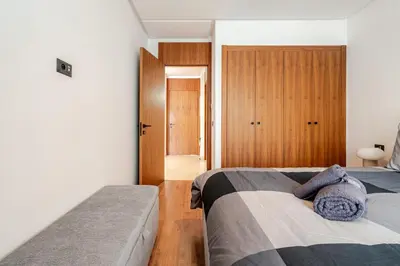 a bedroom with two beds and a door to a hallway at C04 Comfort & Design Studio with Private Terrace CFC in Casablanca