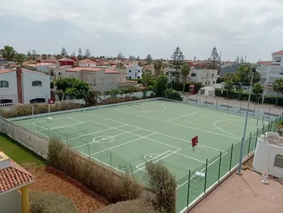 a tennis court in the middle of a city at Appartement à Garden Beach , Sidi Rahal in Sidi Rahal