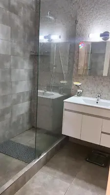 a bathroom with a shower and a sink at Appartement à Garden Beach , Sidi Rahal in Sidi Rahal