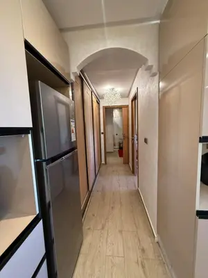 a hallway in a house with an archway at Comfortable apartment temara in Temara
