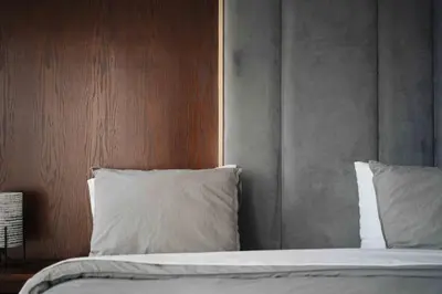 a bed with white sheets and pillows in a room at Luxury Villa Jack Beach Resort Pool & Seaview in Tamaris