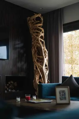 a living room with a large tree root sculpture at Luxury Villa Jack Beach Resort Pool & Seaview in Tamaris
