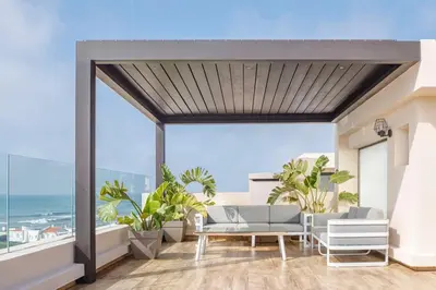 a living room with a view of the ocean at Luxury Villa Jack Beach Resort Pool & Seaview in Tamaris