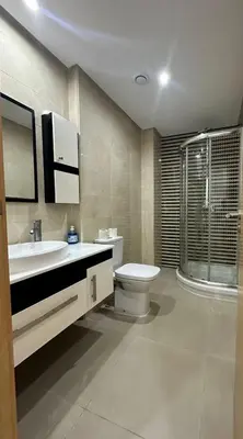 a bathroom with a toilet and a sink and a shower at Vivez Une Expérience Unique à ARMADA in Bouznika