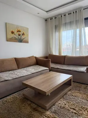 a living room with a couch and a coffee table at Studio les princesses in Casablanca