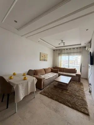 a living room with a couch and a table at Studio les princesses in Casablanca