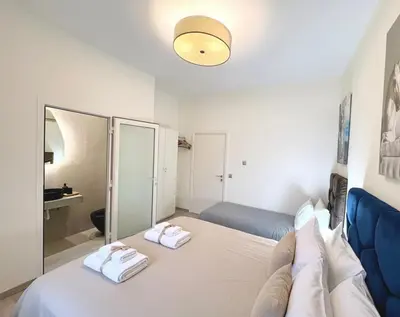 a bedroom with a bed with two towels on it at private villa with swimming pool in Rabat