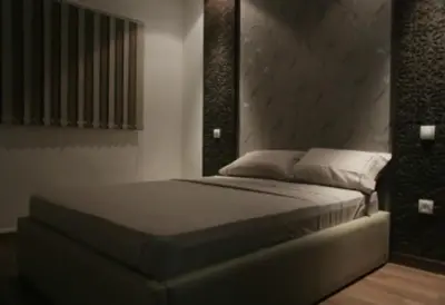 a bedroom with a bed in a room at Rabat Apartments in Rabat