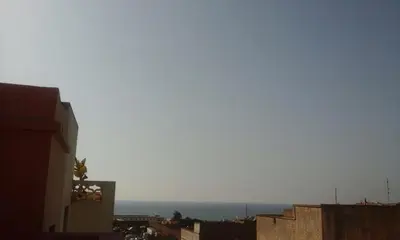 a view of the ocean from a city with buildings at Rabat Apartments in Rabat
