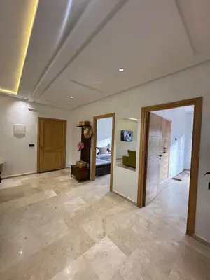 a large living room with a room with a bed at Logement luxueux avec 2 piscines in Dar Hamida