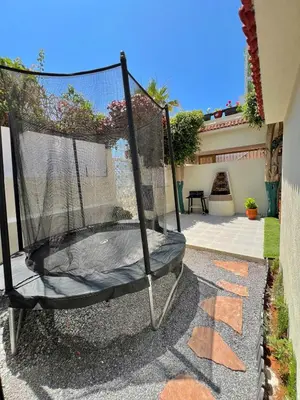 a swing in the backyard of a house at Villa 1 Corniche, Seaside Stay at Carrousel Mall, Walk Everywhere in Rabat