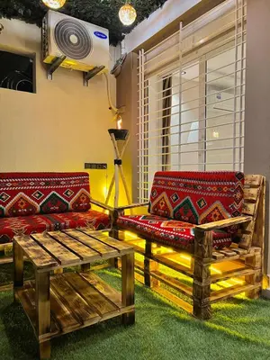 a living room with two couches and a table at Villa 1 Corniche, Seaside Stay at Carrousel Mall, Walk Everywhere in Rabat