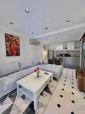 a living room with a couch and a table at Villa 3 Corniche, Charming Seaside Villa with Jacuzzi, Carrousel Mall Rabat in Rabat