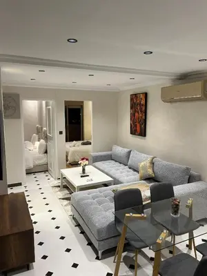 a living room with a couch and a table at Villa 3 Corniche, Charming Seaside Villa with Jacuzzi, Carrousel Mall Rabat in Rabat