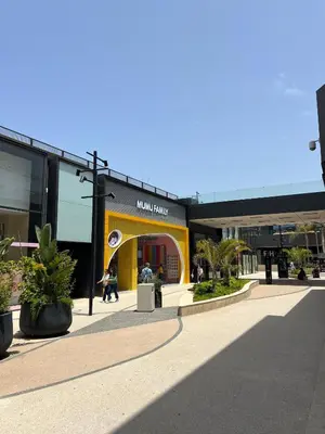a shopping center with a yellow and black building at Villa 3 Corniche, Charming Seaside Villa with Jacuzzi, Carrousel Mall Rabat in Rabat
