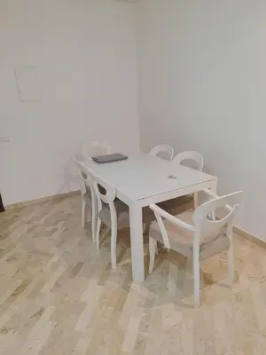 a white table and chairs in a room at Apartment 2 rooms in Agdal in Rabat