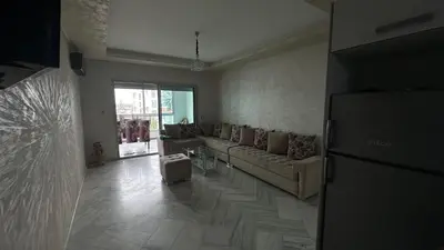 a living room with a couch and a table at La Siesta Beach Resort in Mohammedia