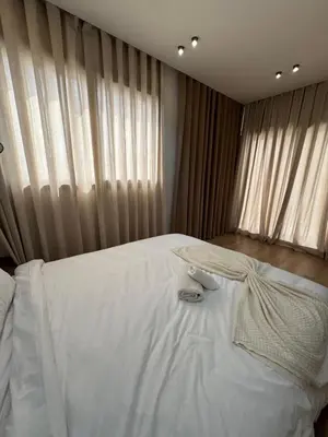 a bedroom with a white bed and a window at ARENA 41- Maarif in Casablanca