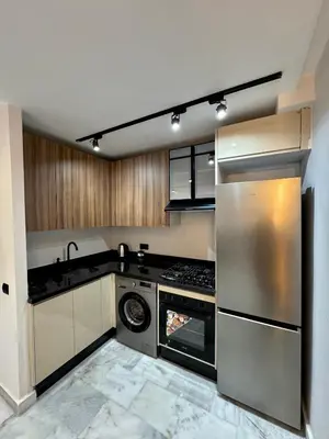 a kitchen with stainless steel appliances and a stove at ARENA 41- Maarif in Casablanca