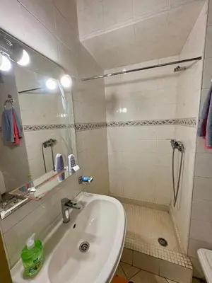 a bathroom with a sink and a shower at Dar Raciki Elikya in Rabat