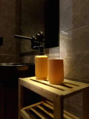 a table with a lamp on it in a bathroom at Rafina in Casablanca