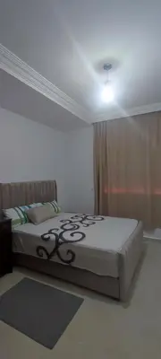 a bedroom with a bed in a room at Appartement Jamila in Rabat