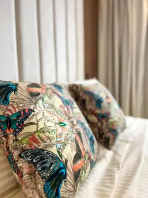 a couch with butterfly pillows on top of it at Rafina in Casablanca
