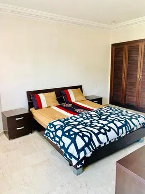a bedroom with a bed and a dresser at Rabat Hay Riad 3 Ideal Rooms in Rabat