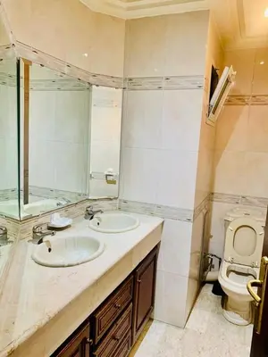 a bathroom with a sink and a toilet at Rabat Hay Riad 3 Ideal Rooms in Rabat