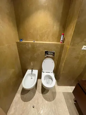 a bathroom with a toilet and a sink at Tamaris Green in Casablanca