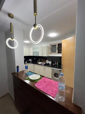 a kitchen with a counter with a bottle of water on it at Tamaris Green in Casablanca