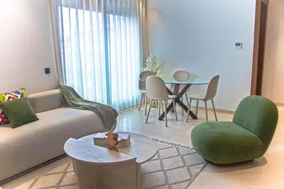 a living room with a couch and a table at Cosy stylé et confortable in Casablanca